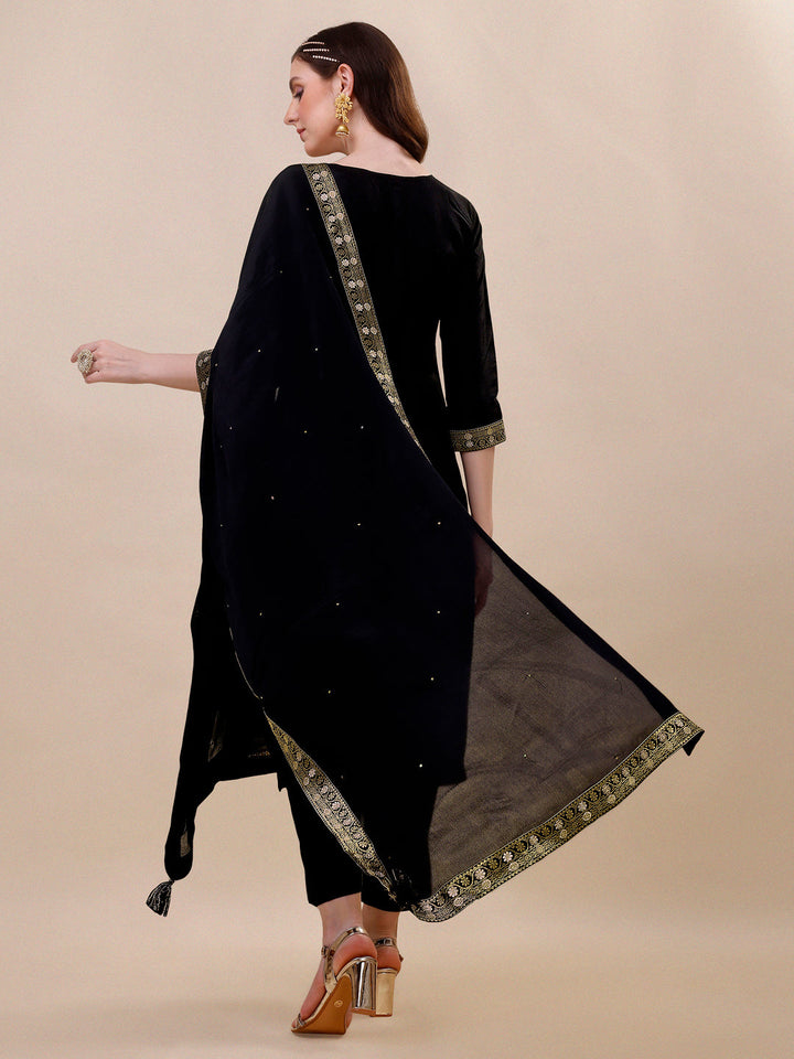 Black Dola Silk Jacquard Kurta . Paired with Santoon Trouser and Chinon Dupatta