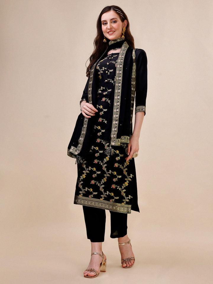 Black Dola Silk Jacquard Kurta . Paired with Santoon Trouser and Chinon Dupatta