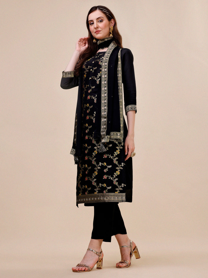 Black Dola Silk Jacquard Kurta . Paired with Santoon Trouser and Chinon Dupatta