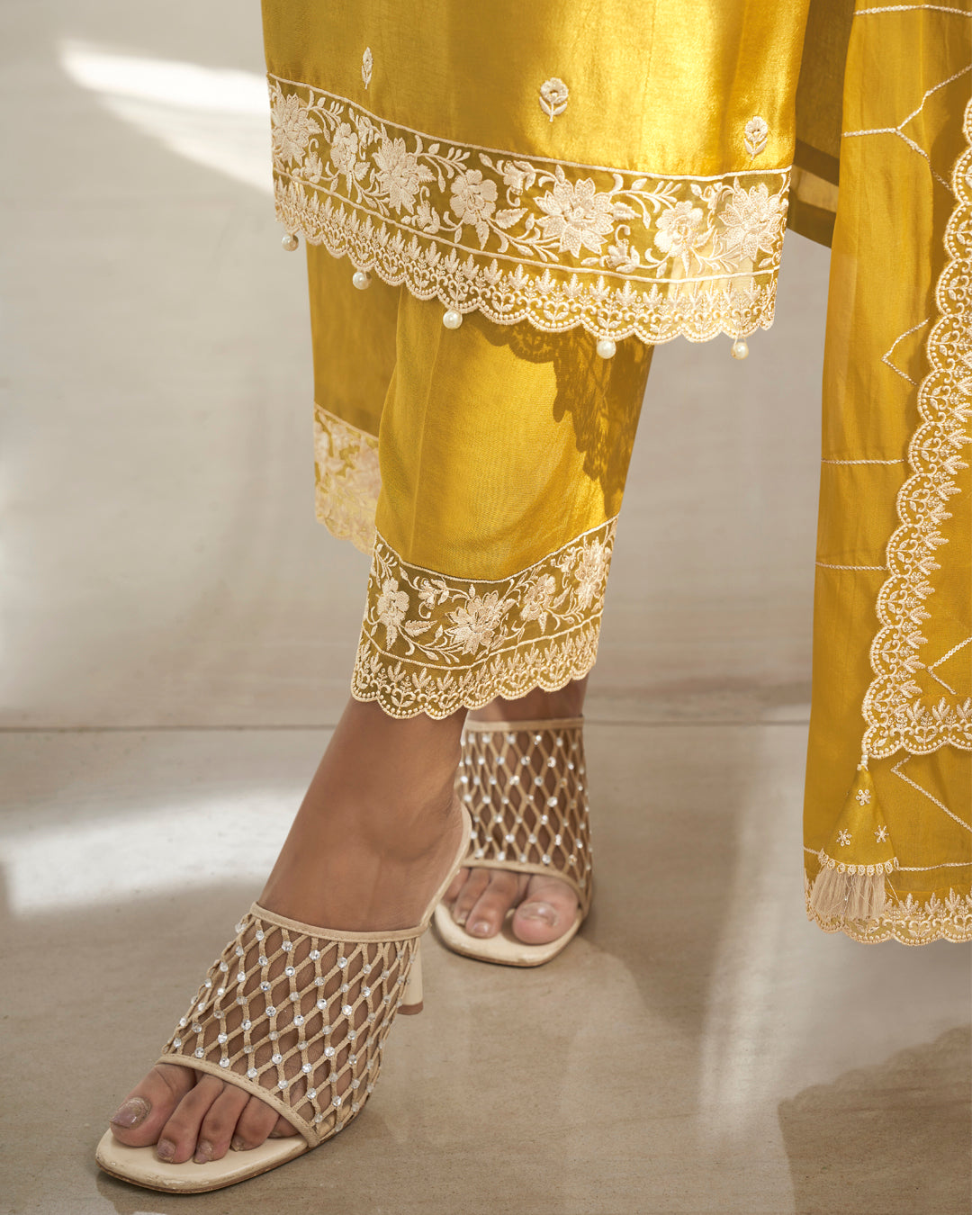 Amber Yellow Dola Silk Kurta . Paired with Santoon Straight Pants and Organza Dupatta