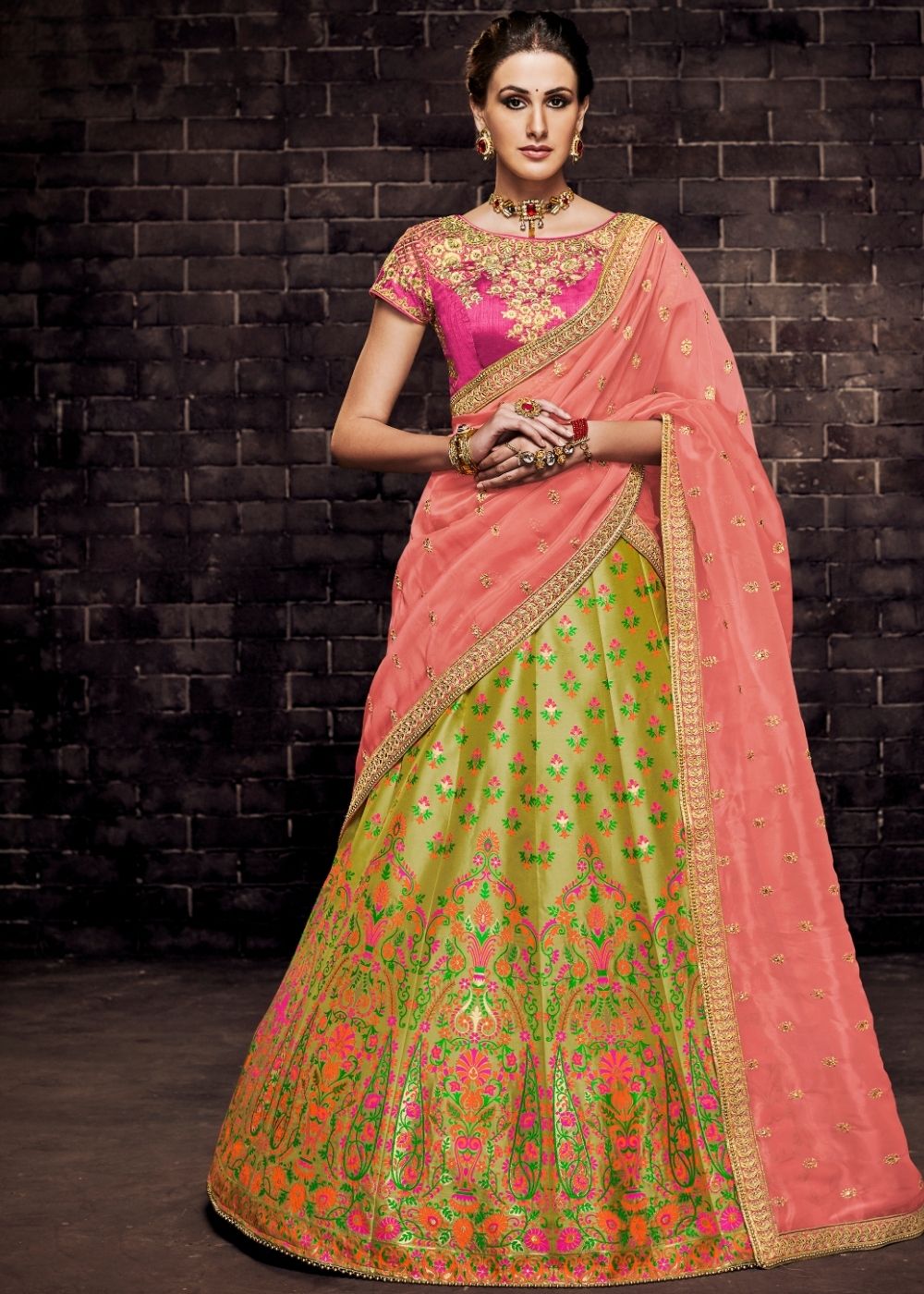 Sitting pretty in this @pooja77rajpaljaggi lehenga. The combination of the  rani pink and parrot green makes it perfect for the festive season. Don't  you think?